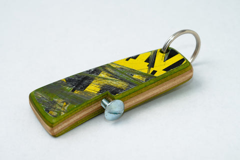 Recycled skateboard bottle opener